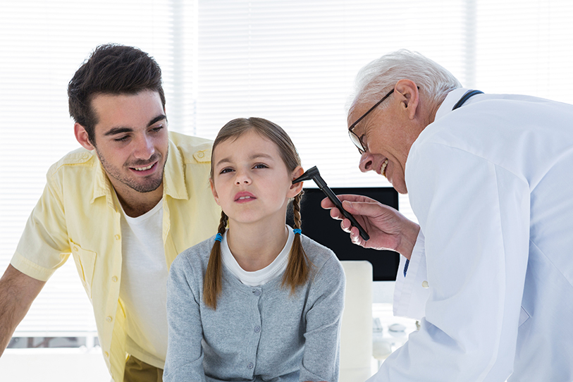 Pediatrician examining a girl's ear infection in Winter Haven FL