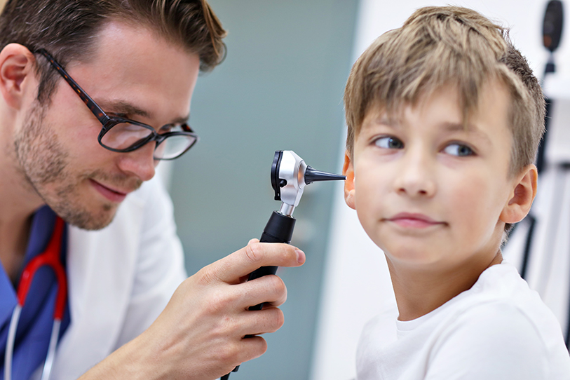 Pediatrician examining a little boy's ear infection in Winter Haven FL